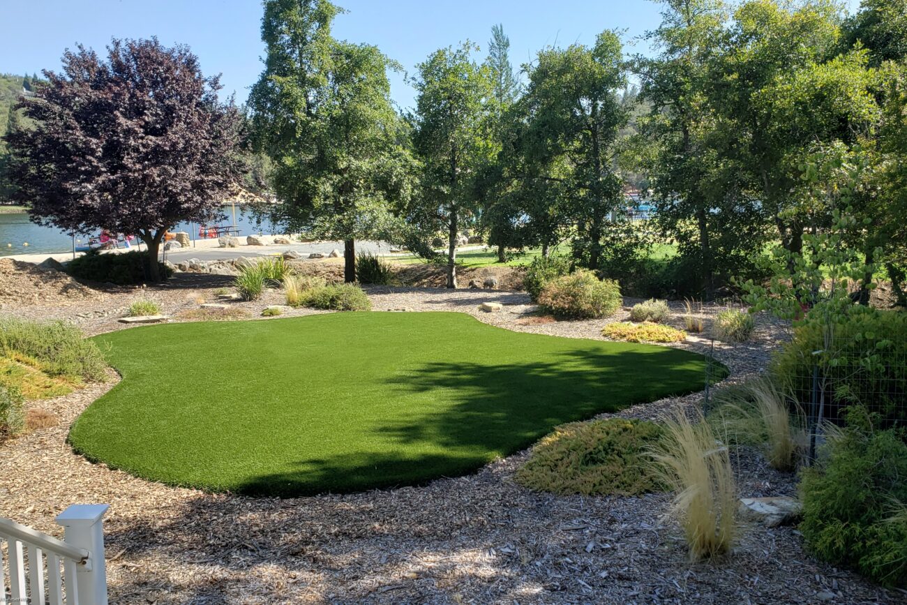 Artificial grass installation on a beach-side property at Lake Wildwood in Penn Valley CA