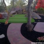 A photo of a challenging artificial grass putting green, fringe, paver walkway and paver patio area in Granite Bay CA.