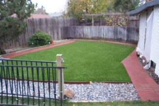 This is the backyard of a residential doggy day care center. This family also breeds small dogs such as Maltese and Yorkies. Their artificial k9 grass lawn is perfect for meet and greets for everyone!